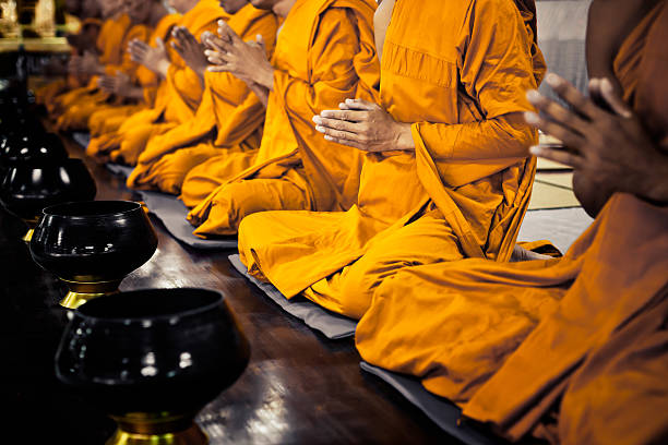 Visiting a Buddhist Temple in Elista: Dos and Don'ts - Visitors respectfully observing Buddhist customs and traditions